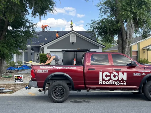 Icon Roofing Group crew and truck on a residential roofing job