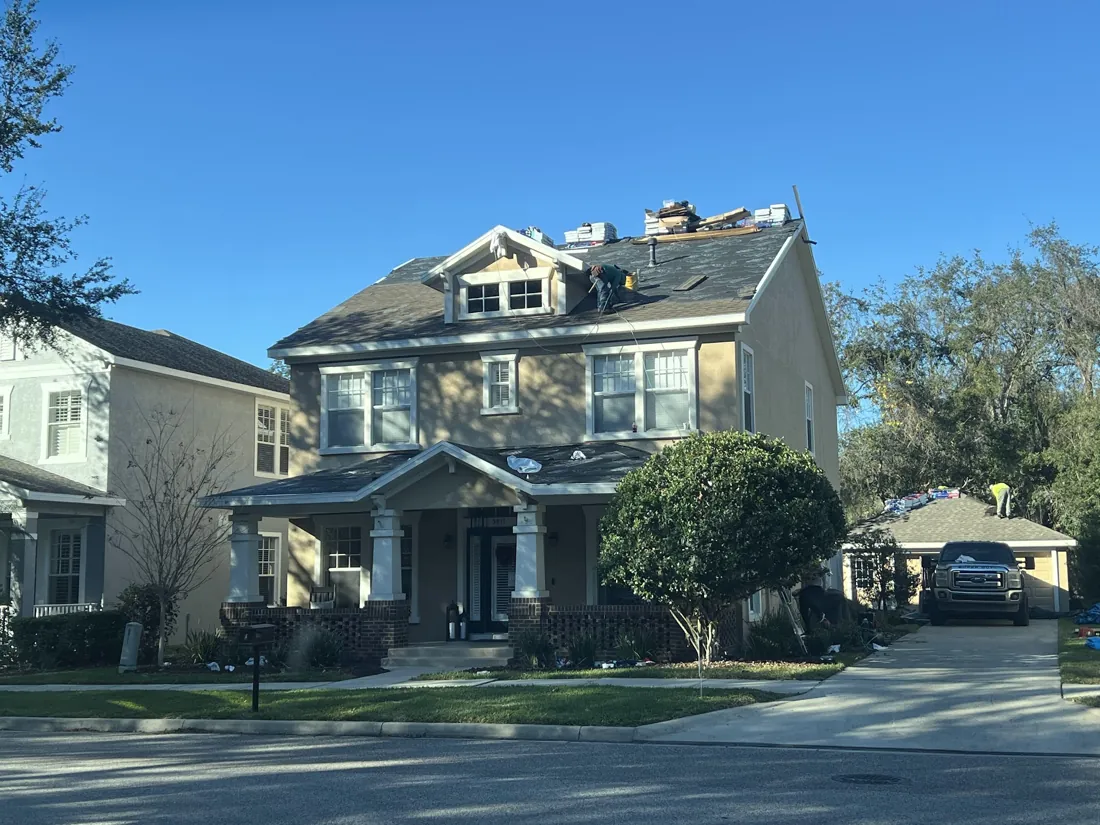 Icon Roofing crew replacing the roof on a two-story Central Florida home