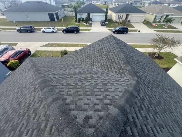 Close-up of a shingle roof ridge and hips
