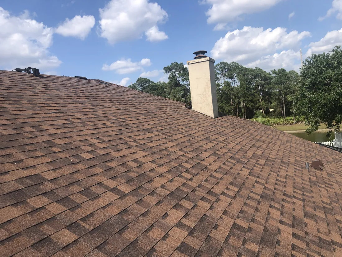 New brown shingle roof with chimney, Central Florida
