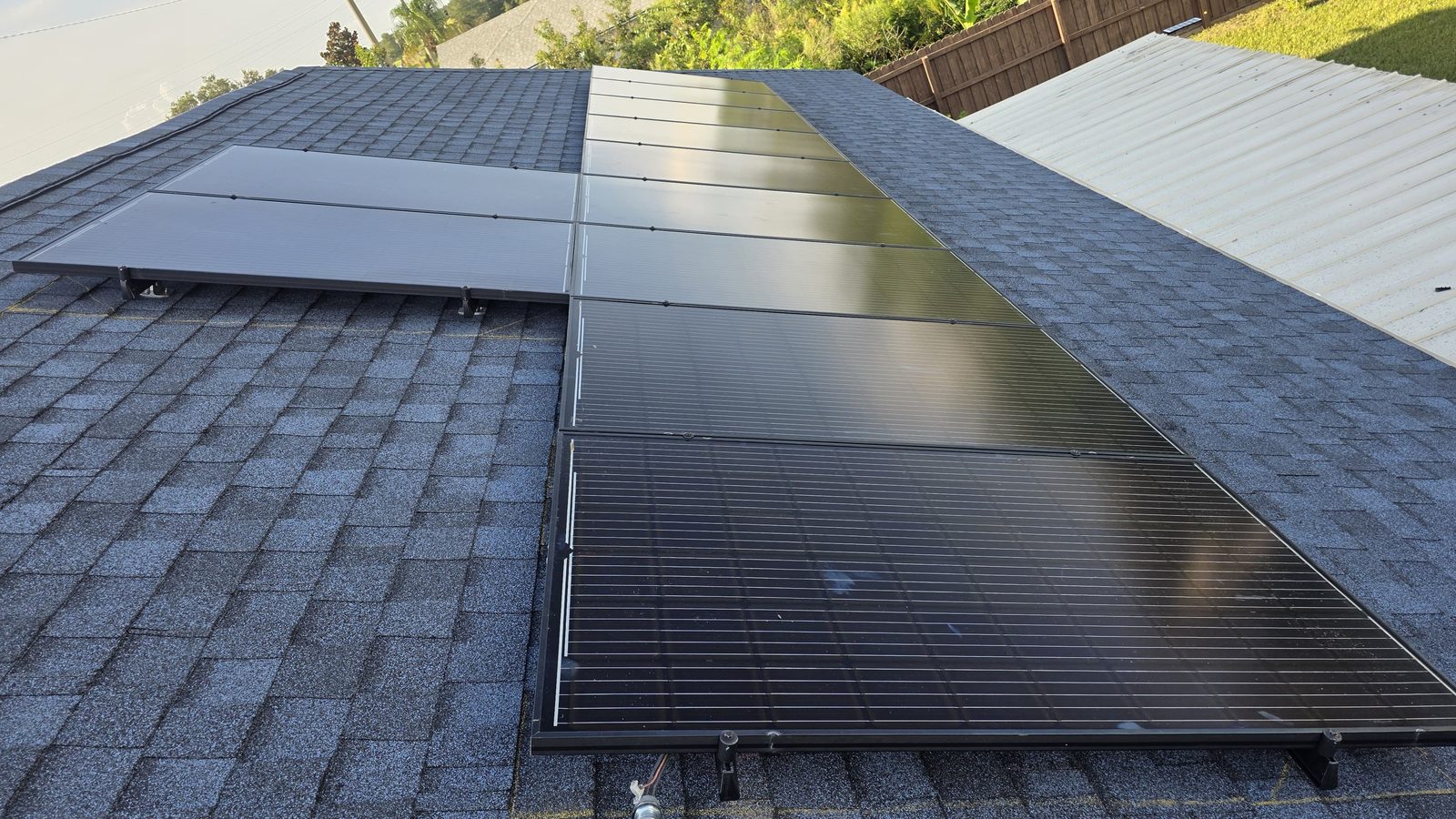 Close-up of a solar panel array installed on a shingle roof, Orlando