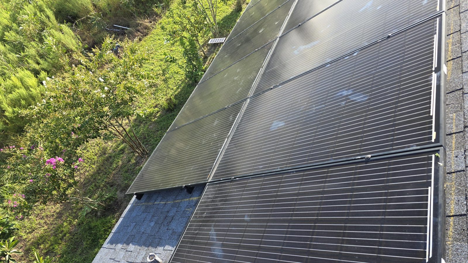 Close-up detail of solar panels mounted on a roof by Icon Roofing Group